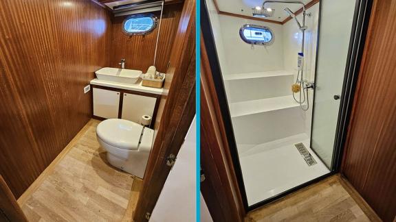 Functional bathroom on Gulet Arni with modern shower and elegant decor.