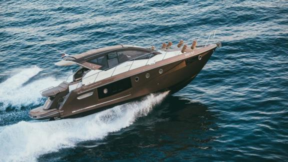 The motor yacht Brown Sugar cruises at high speed through Croatian waters, featuring a modern design.