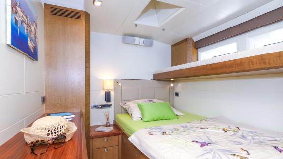 Sailing yacht Bellkara Conrad YCC91 offers a cozy bunk bed cabin for two guests to relax.