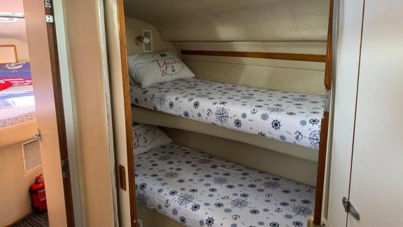 The guest cabin with bunk beds of motor yacht Liberta provides a comfortable sleep.