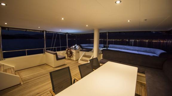 Cosy interior of the Gulet Buse with 5 cabins, illuminated and ready for evening activities.