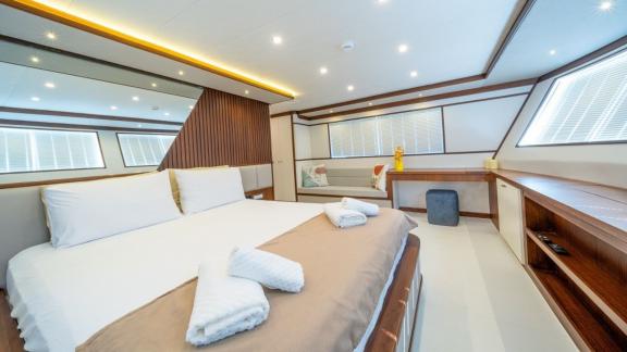 Elegant room with large windows and refined lines for yacht charter in Fethiye.