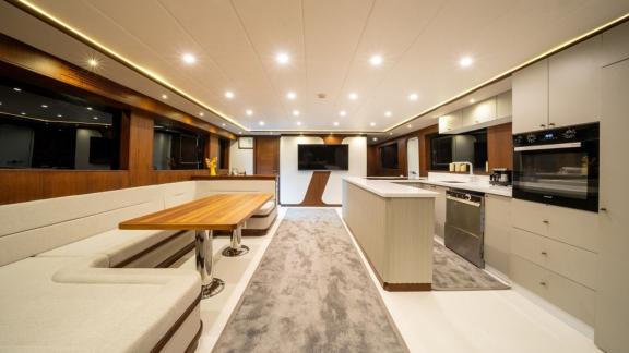 Spacious saloon and fully equipped kitchen aboard the modern By CF trawler yacht.