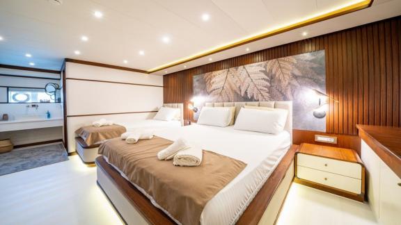 Designed for yacht rental in Fethiye, this triple cabin blends comfort with natural tones.