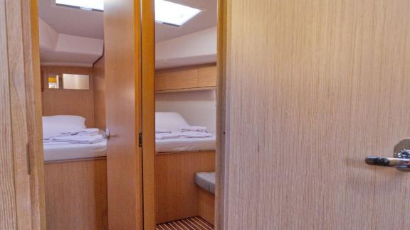 View of the doorway leading to two separate cabins on the Beluga 1 yacht.