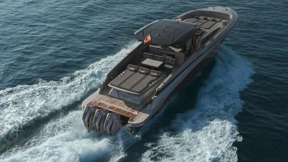Vibe is cruising off Ibiza, showcasing its spacious aft deck and ideal setting for daily yacht charters.