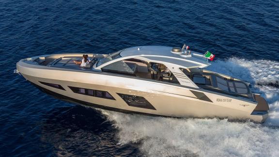 Luxury yacht speeds across open sea with striking modern design and comfort.