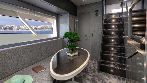 Stylish sea-view salon with sofa on a cruising yacht near Mallorca.