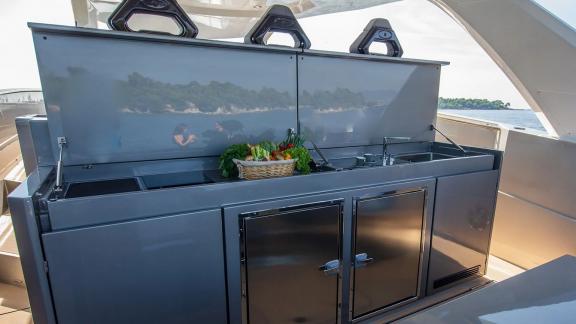 Fresh vegetables are prepared on a modern yacht galley off the coast of Mallorca.