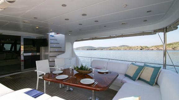 Luxurious dining area with sea view on a yacht in Bodrum, perfect for unforgettable meals.