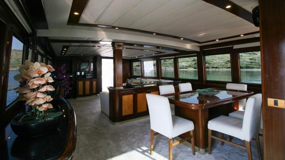 Luxurious dining room inside a yacht in Bodrum, perfect for formal meals with a sea view.