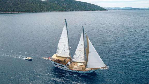 The 22 meter Gulet Castiel sailing gracefully along the scenic coast of Bodrum.