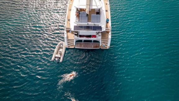 The 7th Heaven catamaran in Athens seen from above, featuring its sea platform and swimming area.