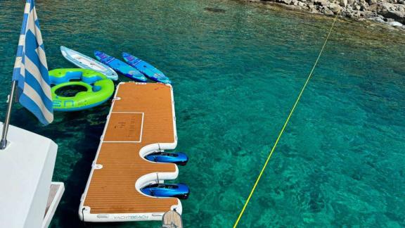 The 7th Heaven catamaran in Athens offers fun with paddleboards and a sea platform.