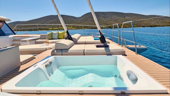 Relax in the jacuzzi with stunning views of Lavrion’s turquoise bay.