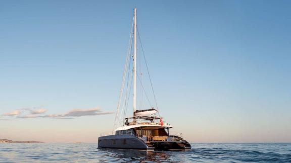 The Adara Next catamaran from Athens glides toward the golden horizon.