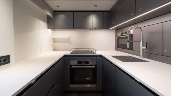 The sleek and functional galley of the Adara Next catamaran, departing from Athens.