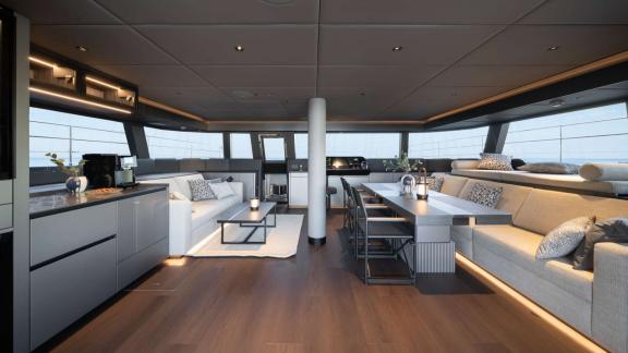 The spacious, modern main saloon of the Adara Next catamaran, departing from Athens.