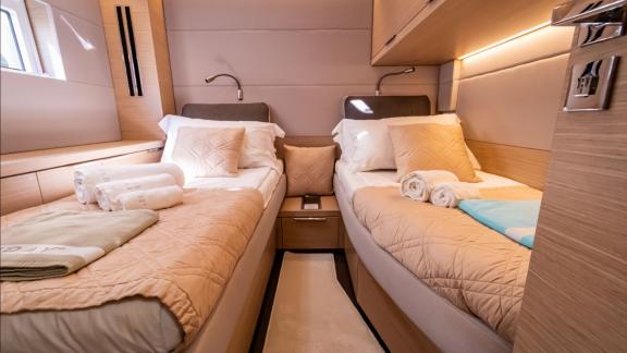 Agenda 55 catamaran features a twin bed guest cabin with modern interiors and comfortable accommodation onboard.