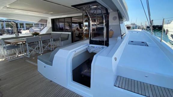 Allure catamaran for rent features elegant seating and spacious layout at the aft.