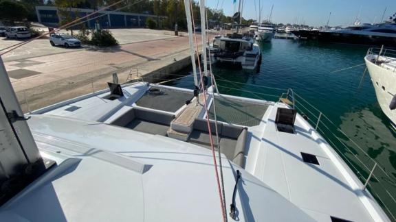 Allure catamaran for rent is moored at the marina waiting for guests.