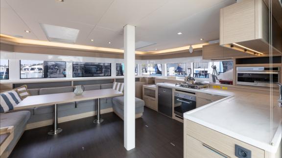 The catamaran Artisan (Lagoon 55) delivers a spacious and modern lounge area onboard, offering premium yacht comfort.