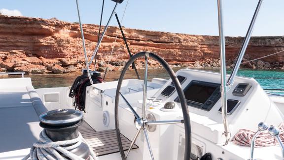 The modern helm station of the Balok catamaran ensures a smooth sail off the coast of Ibiza.