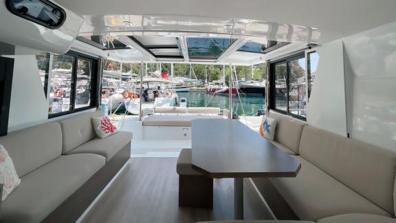 Bright and cozy salon of the Bali 4.2 Catamaran Bella II, perfect for relaxing moments with harbor views.