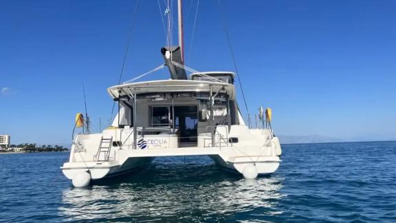 The aft deck of the catamaran Cecilia offers a tranquil setting on the open sea.