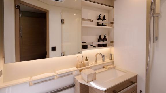The bathroom of Dream catamaran features modern fixtures and elegant details for a refined atmosphere.