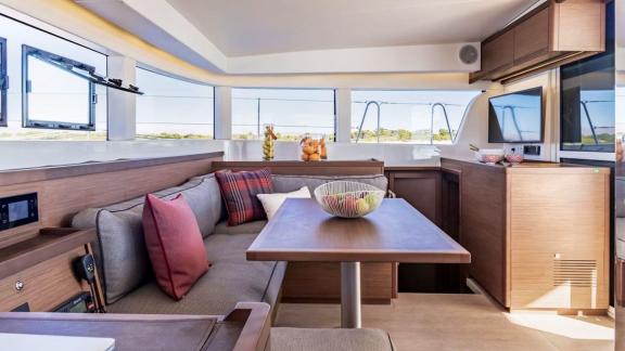 Bright and inviting dining space on the Hayra Lagoon 40 catamaran, perfect for meals with a sea view.