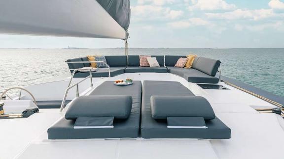 The catamaran Kebisiks offers padded seating and drinks on the flybridge near Athens.