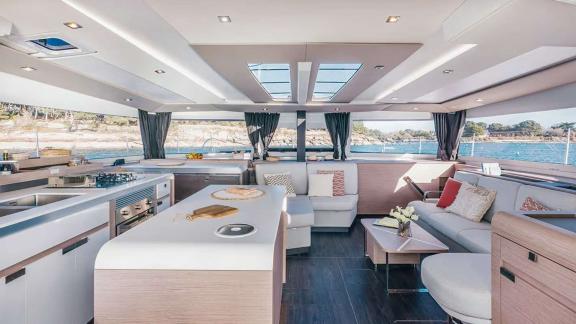 The catamaran Kebisiks features a spacious interior with sea views near Athens.