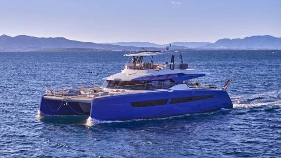 Among catamaran rental options in Athens Majesty of Greece is seen cruising with modern exterior design in open sea.