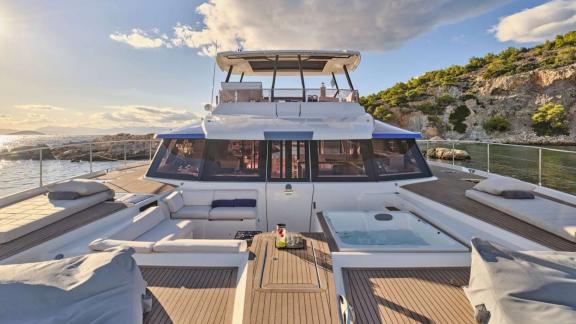 Among catamaran rental options in Athens Majesty of Greece front deck seating and jacuzzi area offers a relaxing space a