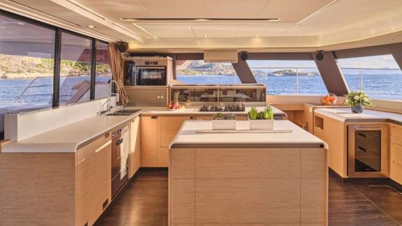 Among catamaran rental options in Athens Majesty of Greece kitchen and prep area offers a clean functional onboard space