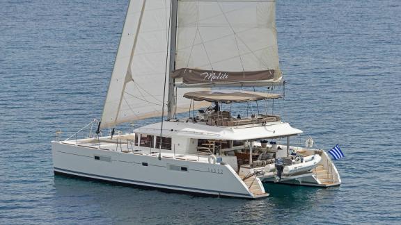 The Lagoon 560 S2 Meliti sailing elegantly off the coast of Athens, perfect for a luxury charter in Greece