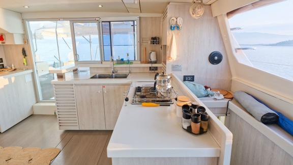 Well-equipped kitchen on Leopard 48 Monaco with a sea view, perfect for culinary experiences on board