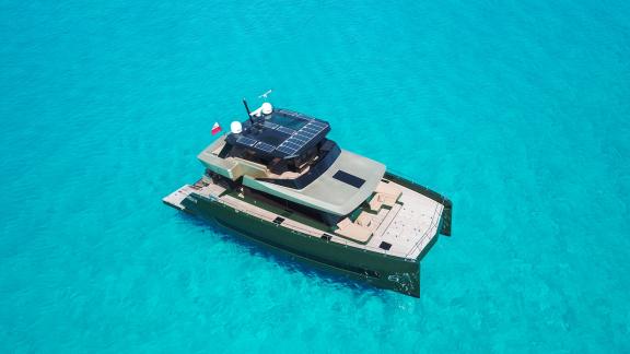 The Moon 60 Over the Moon is calmly anchored in crystal-clear waters near Split, ready for charter.