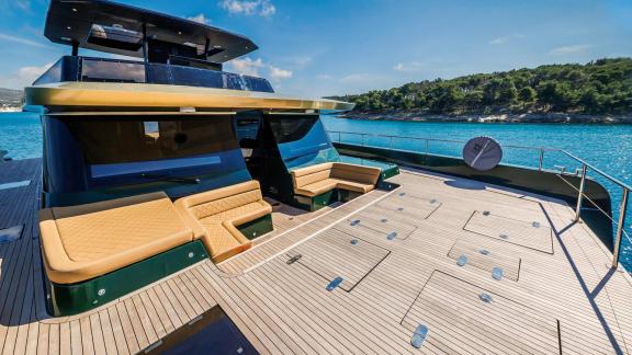 The spacious foredeck with plush seating offers sunny relaxation aboard the Over the Moon in Split.