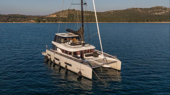 Among catamaran rental options in Kastela Princess Karla is seen anchored in calm sea.