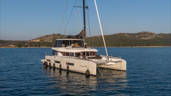 Among catamaran rental options in Kastela Princess Karla is seen anchored in smooth and peaceful sea conditions.