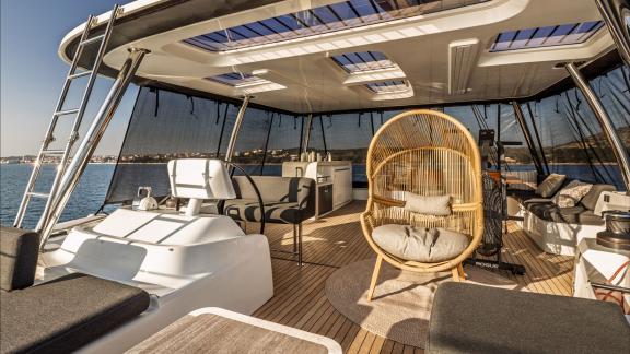 Among catamaran rental options in Kastela the upper deck lounge and seating area of Princess Karla.