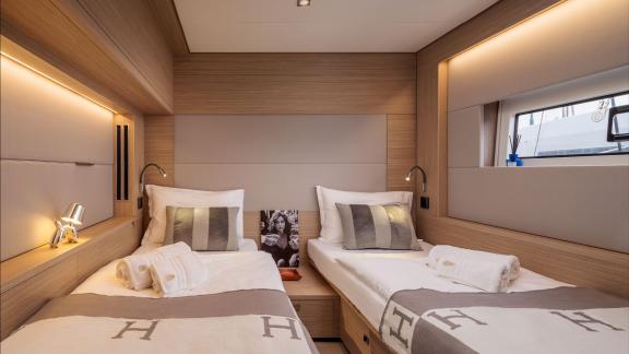 Among catamaran rental options Princess Karla twin bed cabin offers a comfortable and practical onboard stay.