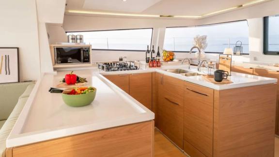 Functional kitchen on the Sahana catamaran with a spacious countertop and modern equipment.