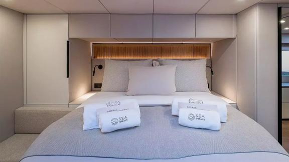 Guest cabin of the Sunreef 60 Sea Dreams catamaran in Split Marina, Croatia, offering comfort for yacht charter holidays