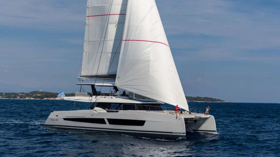 Fountaine Pajot 80 Serenissima III is cruising under sail along the waters of Athens yacht charter routes.
