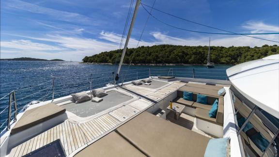 Enjoy sunbathing and peaceful sea views on Sunreef 60 Sinata’s spacious foredeck.
