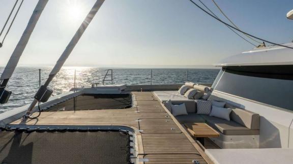 The catamaran Spice of Life features cushioned seating and sea views near Athens.