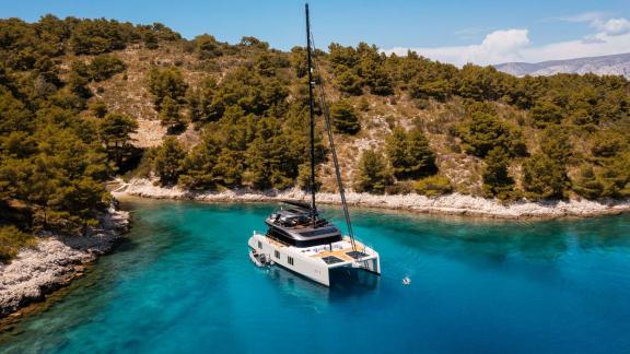 N1 Sunreef 70 catamaran anchored in clear waters of a quiet bay close to Kastela.